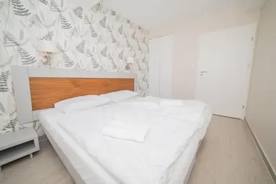 Łóżko lub łóżka w pokoju w obiekcie VacationClub - Stubai Apartament 26