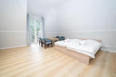 Łóżko lub łóżka w pokoju w obiekcie VacationClub - Zdrojowa 7 Apartament 7