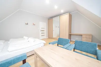 Łóżko lub łóżka w pokoju w obiekcie VacationClub - Zdrojowa 7 Apartament 10