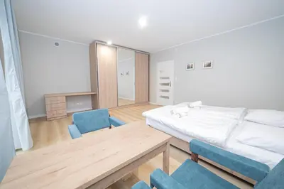 Łóżko lub łóżka w pokoju w obiekcie VacationClub – Zdrojowa 7 Apartament 6