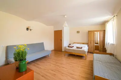 Łóżko lub łóżka w pokoju w obiekcie Apartament Wielka Sowa