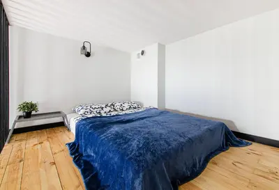 Łóżko lub łóżka w pokoju w obiekcie Loft City Center Apartments- Parking, Wifi, 24h Check-In