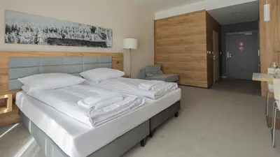 Łóżko lub łóżka w pokoju w obiekcie VacationClub - Aparthotel Czarna Góra, Apartament 339