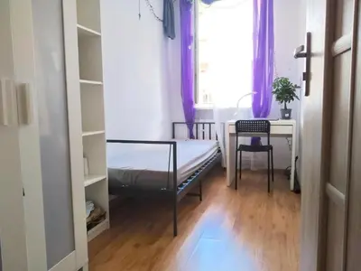 Łóżko lub łóżka w pokoju w obiekcie Noclegi - Wyspa Słodowa Rynek Centrum