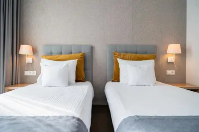 Łóżko lub łóżka w pokoju w obiekcie Hotel Arkadia Jelcz-Laskowice