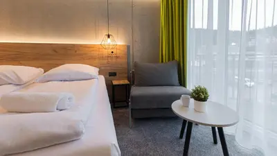 Łóżko lub łóżka w pokoju w obiekcie VacationClub - Czarna Perła Apartament 514