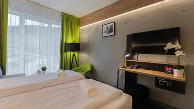Łóżko lub łóżka w pokoju w obiekcie VacationClub - Czarna Perła Apartament 514