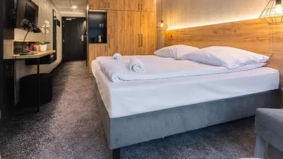 Łóżko lub łóżka w pokoju w obiekcie VacationClub - Czarna Perła Apartament 514