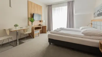 Łóżko lub łóżka w pokoju w obiekcie VacationClub - Aparthotel Czarna Góra Apartament 239