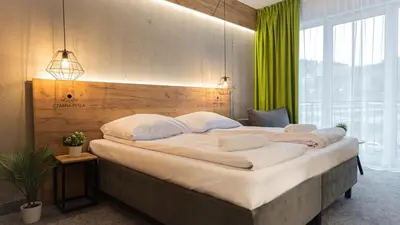 Łóżko lub łóżka w pokoju w obiekcie VacationClub - Czarna Perła Apartament 201