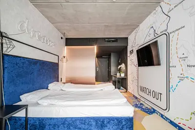 Łóżko lub łóżka w pokoju w obiekcie VacationClub - Biała Perła Apartament 301