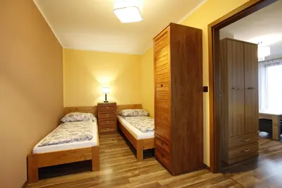 Łóżko lub łóżka w pokoju w obiekcie Willa Górski Widok