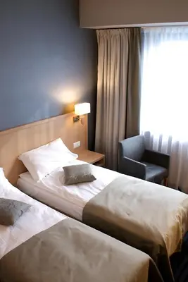 Łóżko lub łóżka w pokoju w obiekcie Hotel Lazur SPA & Conference