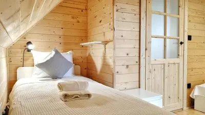 Łóżko lub łóżka w pokoju w obiekcie Pokoje i Domki Na Szlaku