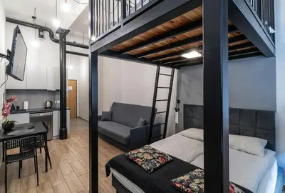 Łóżko lub łóżka w pokoju w obiekcie Apartamenty loftowe blisko Rynku