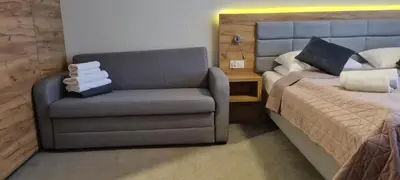 Łóżko lub łóżka w pokoju w obiekcie Aparthotel Apartamenty Czarna Góra 233