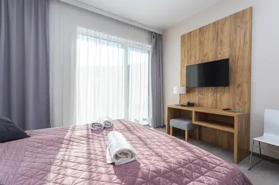 Łóżko lub łóżka w pokoju w obiekcie Aparthotel Apartamenty Czarna Góra 330