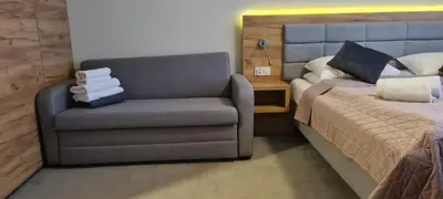 Łóżko lub łóżka w pokoju w obiekcie Aparthotel Apartamenty Czarna Góra 113