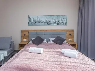 Łóżko lub łóżka w pokoju w obiekcie Aparthotel Apartamenty Czarna Góra 322