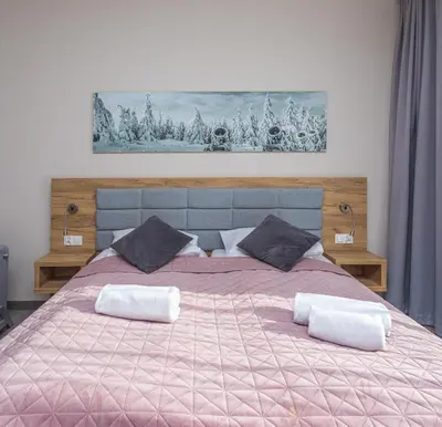 Łóżko lub łóżka w pokoju w obiekcie Aparthotel Apartamenty Czarna Góra 217