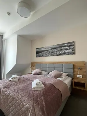 Łóżko lub łóżka w pokoju w obiekcie Aparthotel Apartamenty Czarna Góra 417