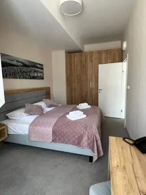 Łóżko lub łóżka w pokoju w obiekcie Aparthotel Apartamenty Czarna Góra 414