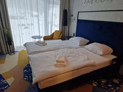 Łóżko lub łóżka w pokoju w obiekcie Biala Perla Sunny Mountain 601